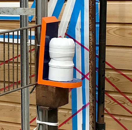 Plaster cast of bottle on painted shelf with blue pvc.